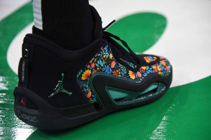 Boston Celtics forward Jayson Tatum's black and green Jordan Brand sneakers.